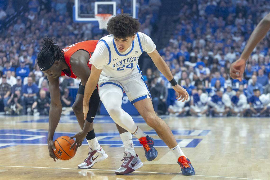 Georgia center Somto Cyril (2) grabs a loose ball in front of Kentucky freshman center Malachi Moreno (24) during a game at Rupp Arena on Tuesday.