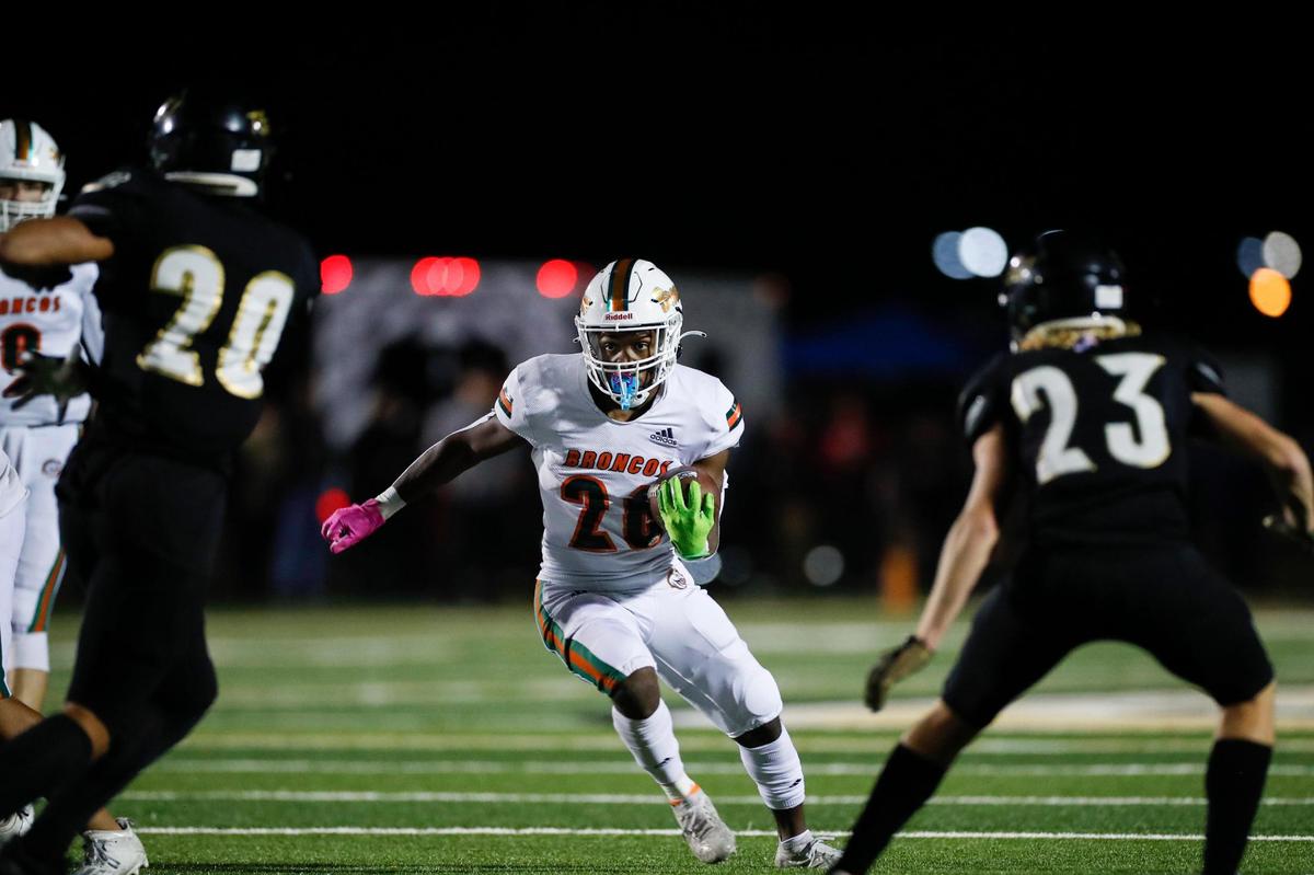 Davaun Hart (26) of Frederick Douglass looked for running room against the Rebels on Friday night.