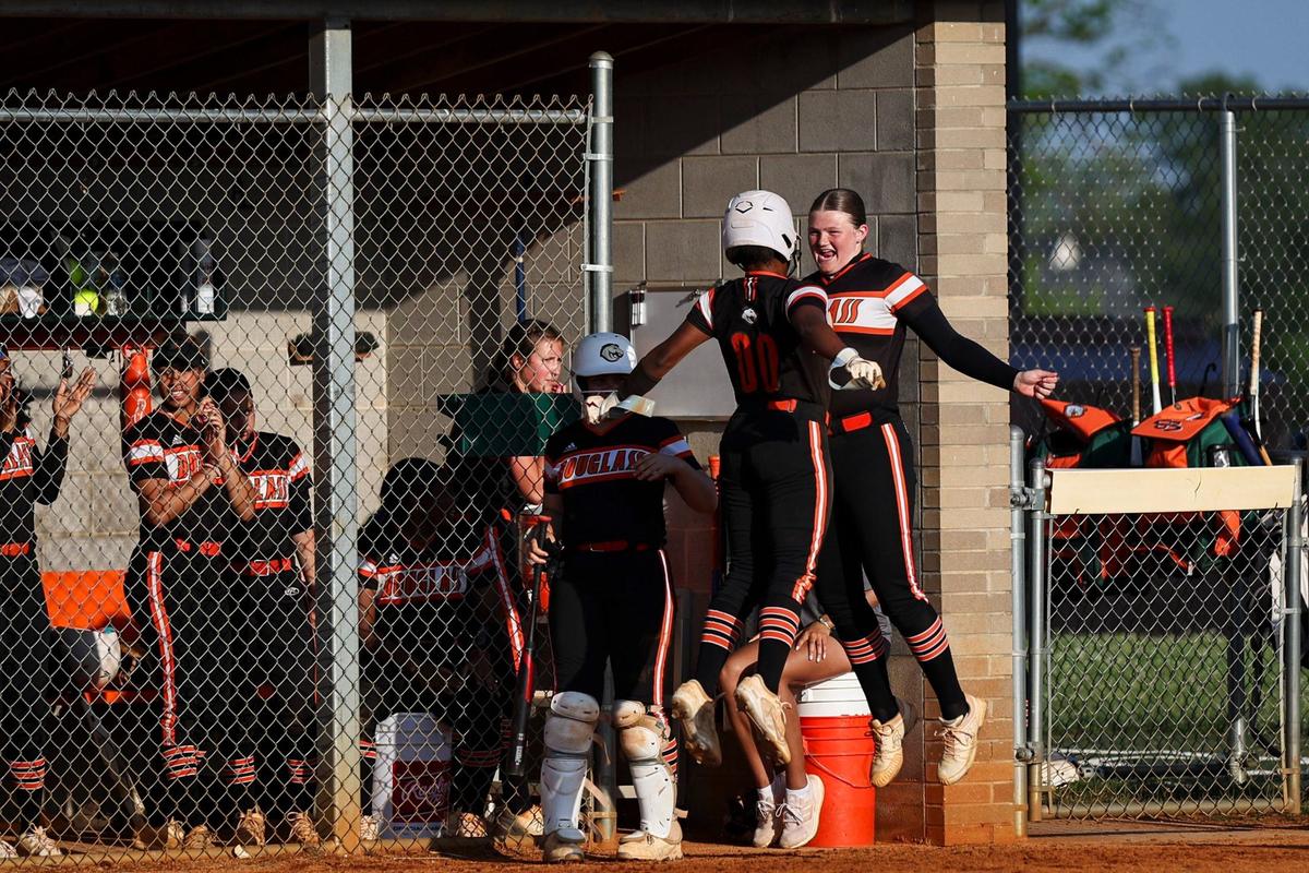 Frederick Douglass’ Jarynn Bowman (00) celebrates scoring with teammate Haley McGuire during Thursday’s game against visiting Bryan Station.