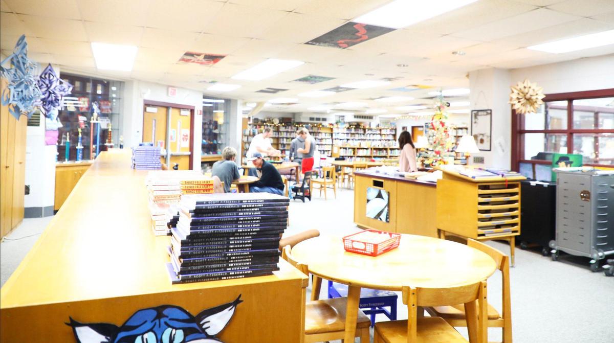 High school students engage in table games, complete school work, and socialize in the senior library at Lee County Middle High School on September 4, 2024, in Beattyville, Ky