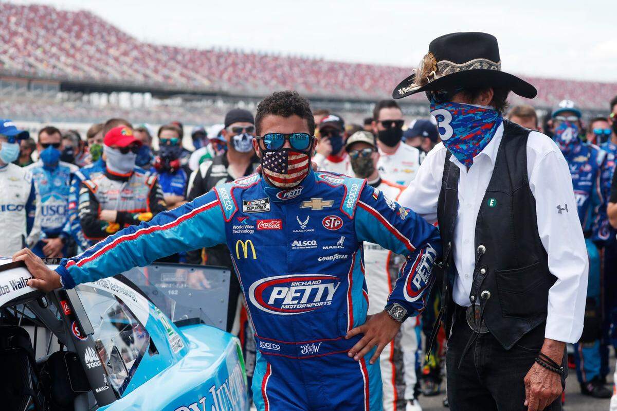 Team owner Richard Petty, right, stood with driver Bubba Wallace prior to the start of the NASCAR Cup Series Geico 500 at Talladega Superspeedway on June 22.