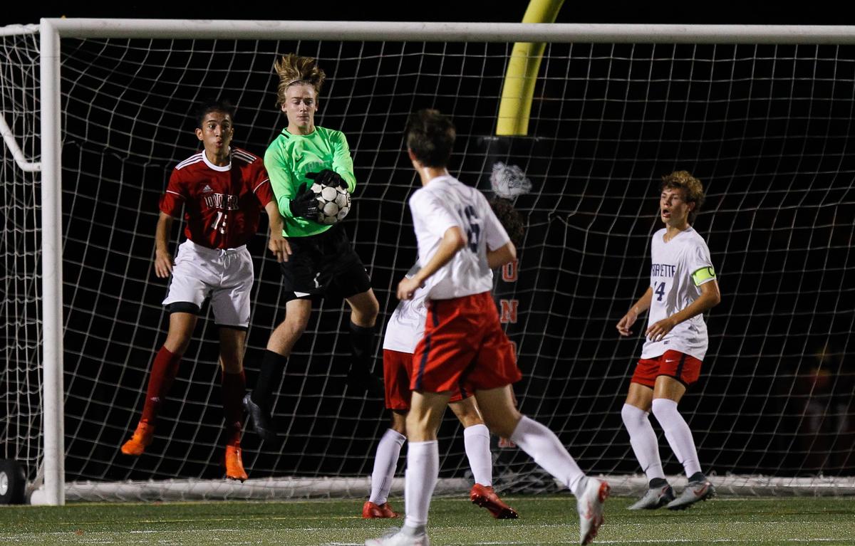 Lafayette keeper Justin Puckett made a save against Paul Laurence Dunbar last season. Puckett returns for the Generals in 2019.
