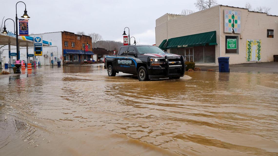 A Lee County sheriff’s truck drives through flood waters, Sunday, Feb. 14, 2025, in downtown Bearryvile, Ky. after officials closed Main Street in the Eastern Kentucky town following severe overnight rain.