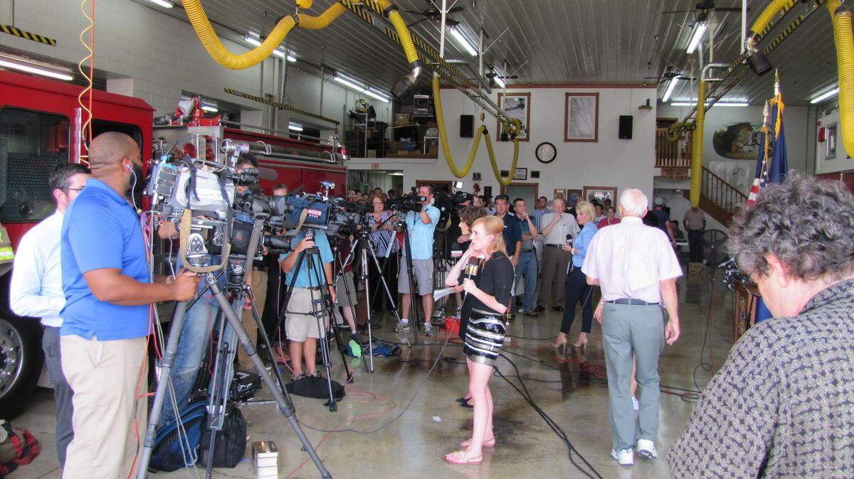 Members of the media gathered for a news conference at the fire department in Campbellsville after two firefighters were seriously injured on Aug. 21, 2014. Bill Estep photo