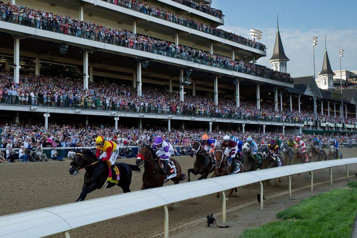 Danzing Candy with Mike Smith up, left, and Nyquist with Mario Gutierrez up run with the field under the spires for the first time during the 142nd running of the Kentucky Derby, Saturday, May 07, 2016 at Churchill Downs in Louisville.