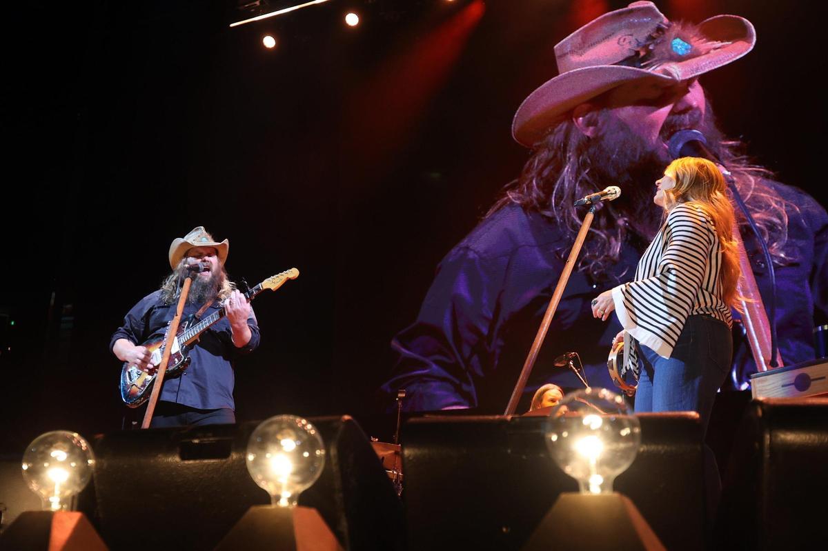 Chris Stapleton, left, performs with his wife during the Kentucky Rising benefit concert at Rupp Arena in Lexington, Ky., Tuesday, Oct. 11, 2022. (Photo by James Crisp)