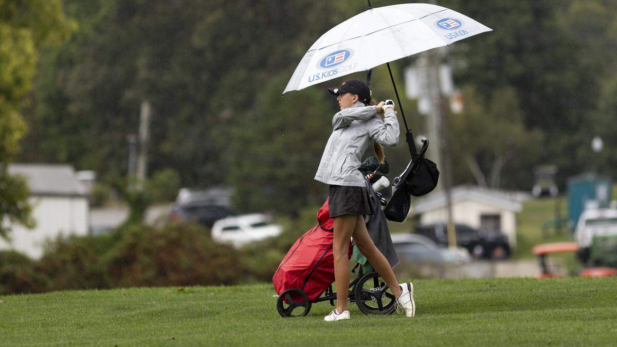Frederick Douglass’ Willa Borough watched her approach shot to the 14th green as intermittent rain began to fall again during the 9th Region Girls Golf Championship at Lakeside Golf Course on Wednesday.