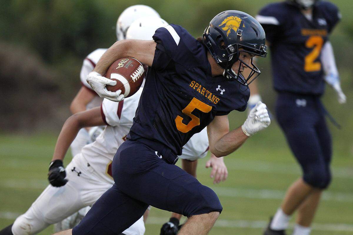 Sayre’s Daniel Clinkinbeard ran for a touchdown against Bourbon County. “I just always try to keep it focused on the kids,” Sayre Coach Chad Pennington said. “If I was caught up in winning and competing, I would go somewhere else to coach. I would go to college or the pros and try to be in that industry.”