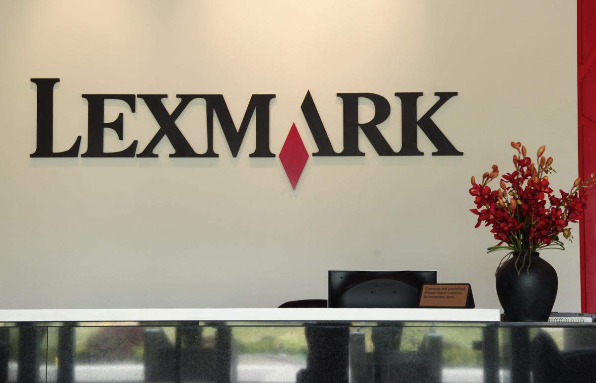 Logo behind reception desk at Lexmark in Lexington, Ky., on Aug. 28, 2012. Photo by Pablo Alcala | Staff