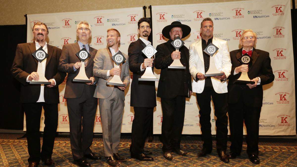 Inductees, from left, Larry Cordle, Clarence Spalding, Brian Littrell, Kevin Richardson, Eddie Montgomery, Troy Gentry and Pete Stamper posed before the Kentucky Music Hall of Fame Induction Ceremony at the Lexington Center Ballroom in Lexington, Ky., on April 10, 2015. Photo by Pablo Alcala | Staff