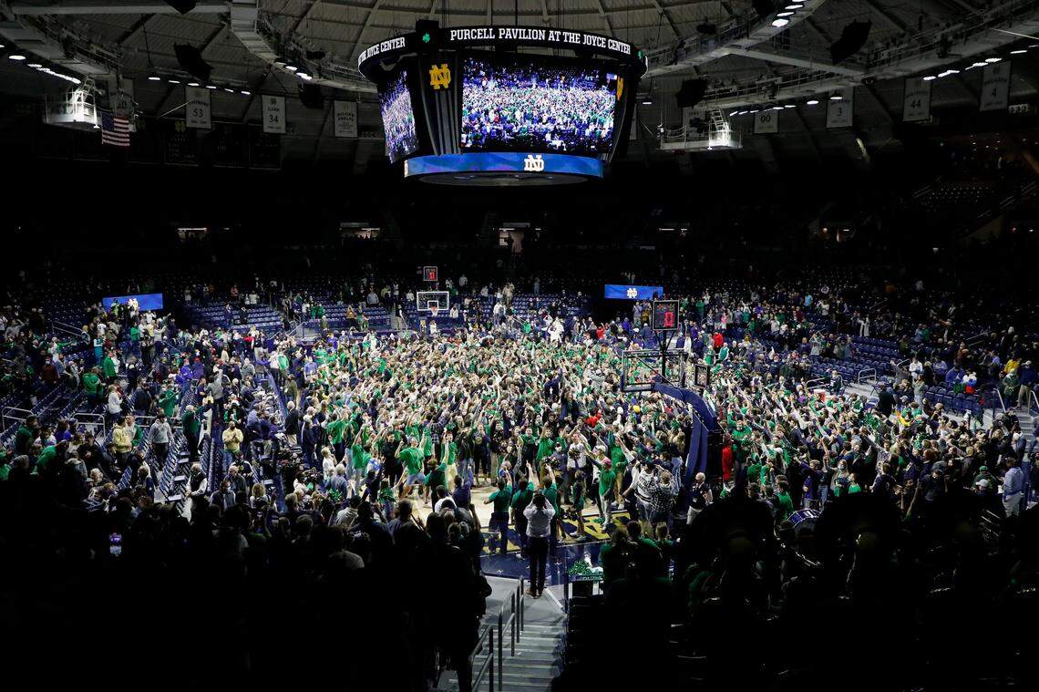 Notre Dame Fighting Irish fans rush the court after defeating the Kentucky Wildcats 66-62 during a game at the Purcell Pavilion at the Joyce Center in South Bend, Ind., Saturday, Dec. 11, 2021.