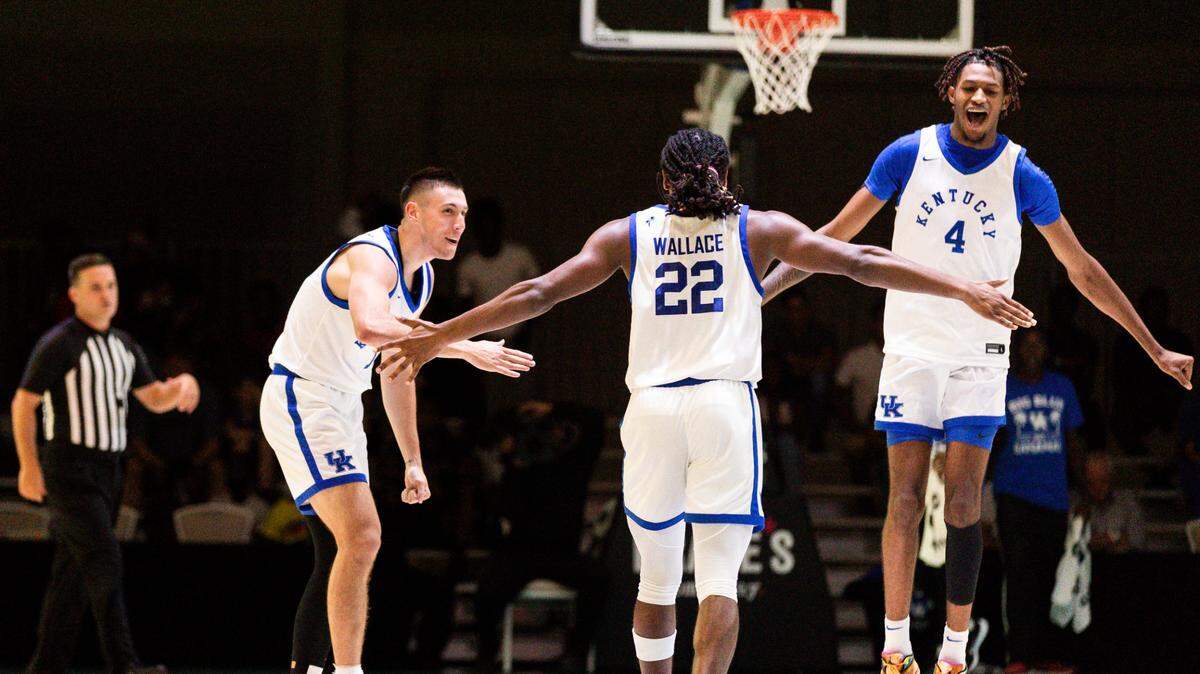CJ Fredrick, Cason Wallace (22) and Daimion Collins (4) celebrate during Kentucky’s 108-56 victory over the Dominican Republic National Select Team on Wednesday night at Nassau, Bahamas.
