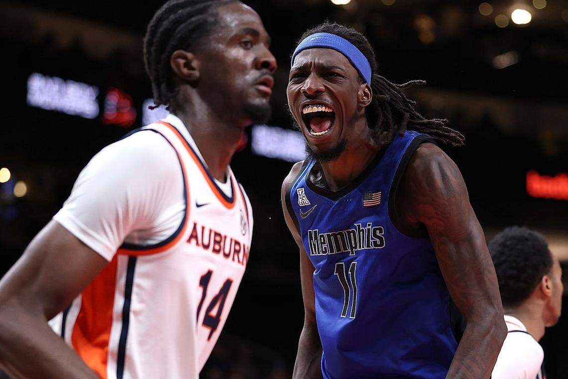 ATLANTA, GEORGIA - OCTOBER 30: Aaron Bradshaw #11 of the Memphis Tigers reacts after dunking against Emeka Opurum #14 of the Auburn Tigers during the first half of The Bad Boy Mowers Series between the Auburn Tigers and Memphis Tigers at State Farm Arena on October 30, 2025 in Atlanta, Georgia. (Photo by Kevin C. Cox/Getty Images)
