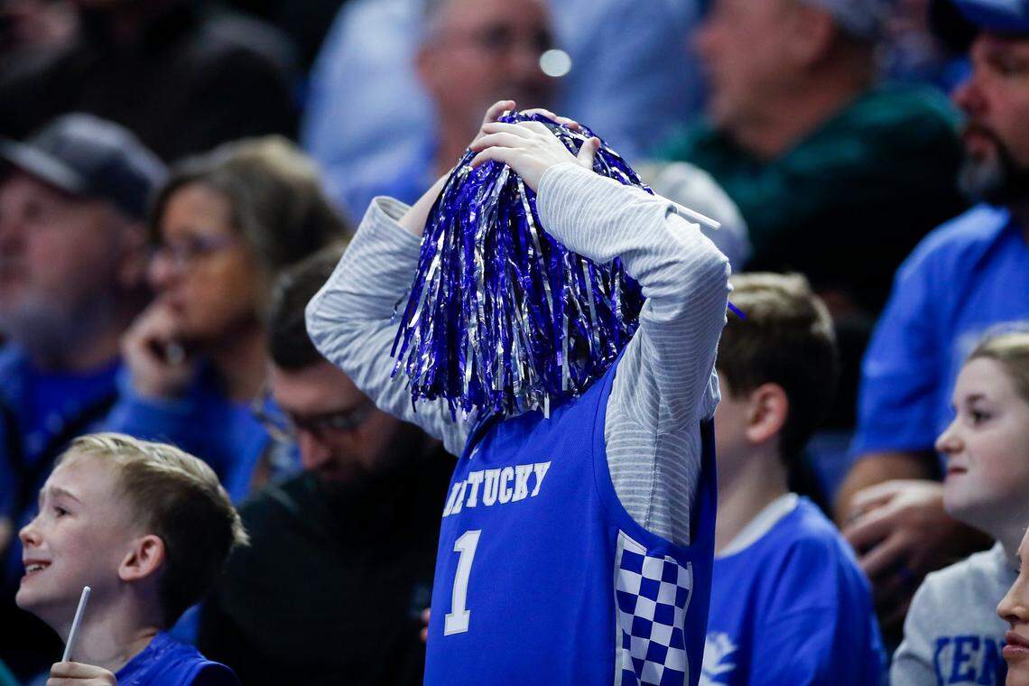 A Kentucky fan puts a pompom over their face during Tuesday’s game against South Carolina.
