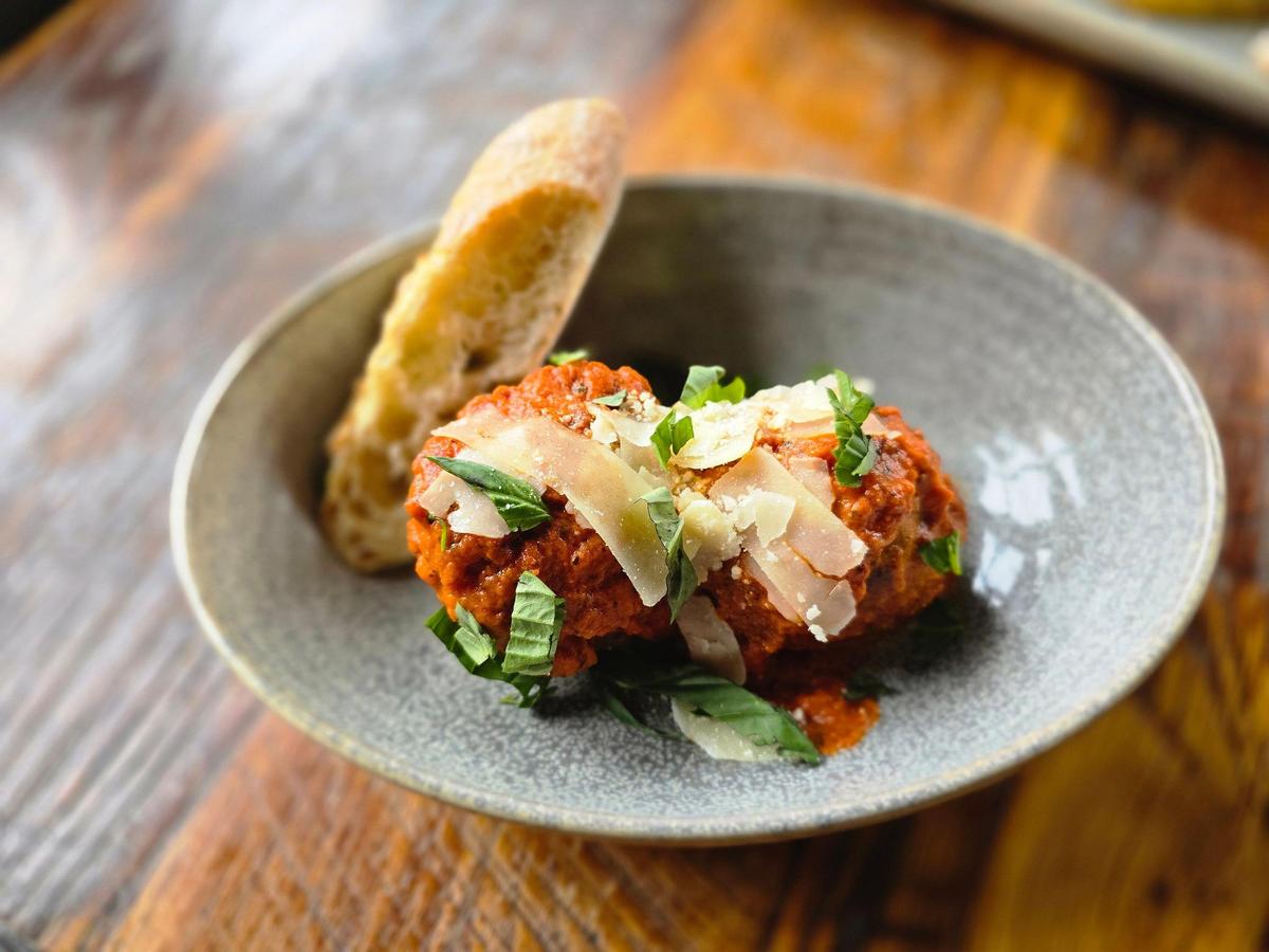 The Meatballs appetizer ($10) at Crust comes with tomato basil cream sauce and grilled ciabatta.