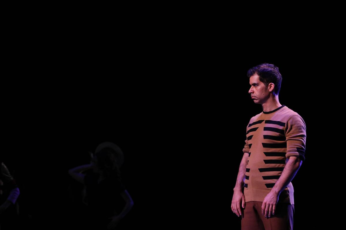 Denis Lambert rehearses onstage as “Zach,” who judges the audition in “A Chorus Line.”
