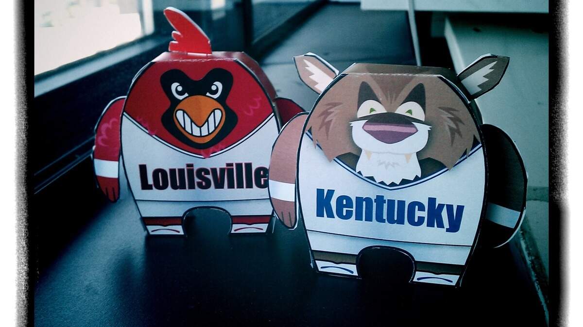 The finished version of the craft paper toy University of Louisville Cardinal and University of Kentucky Wildcat by Lexington Herald-Leader artist Chris Ware.