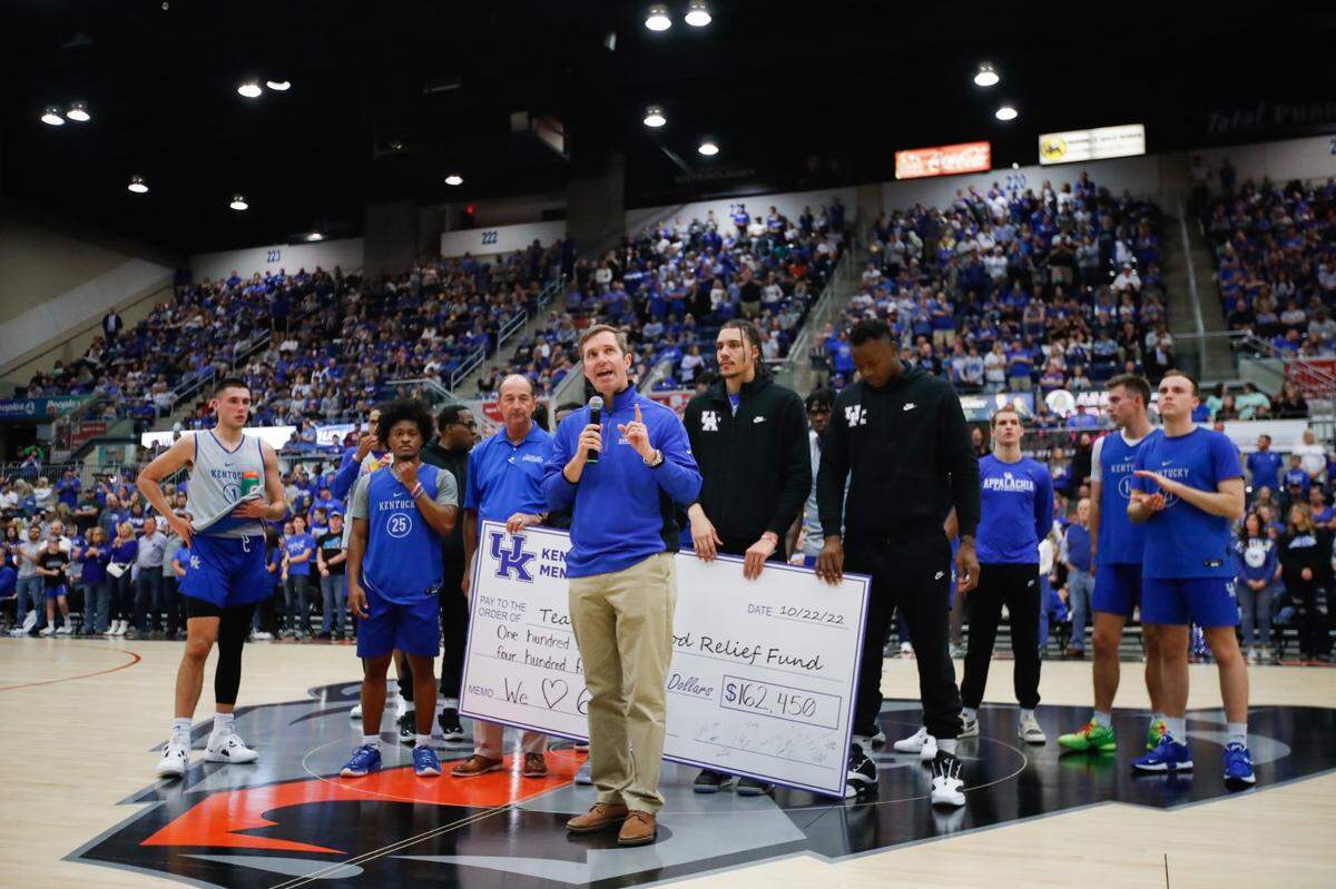 Kentucky Gov. Andy Beshear speaks to the crowd Saturday night inside Appalachian Wireless Arena in Pikeville. The Kentucky men’s basketball team presented Beshear with a check for $162,450 to Beshear’s Team Eastern Kentucky Flood Relief fund during UK’s Blue-White Game.