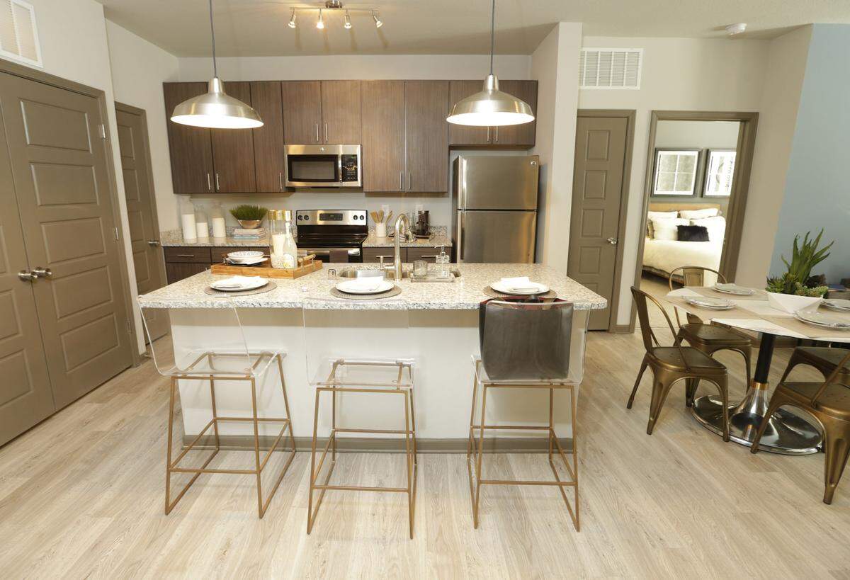 The kitchen of a model unit at The Henry apartments at The Summit at Fritz Farm, which sold for a record per unit and total price last week.