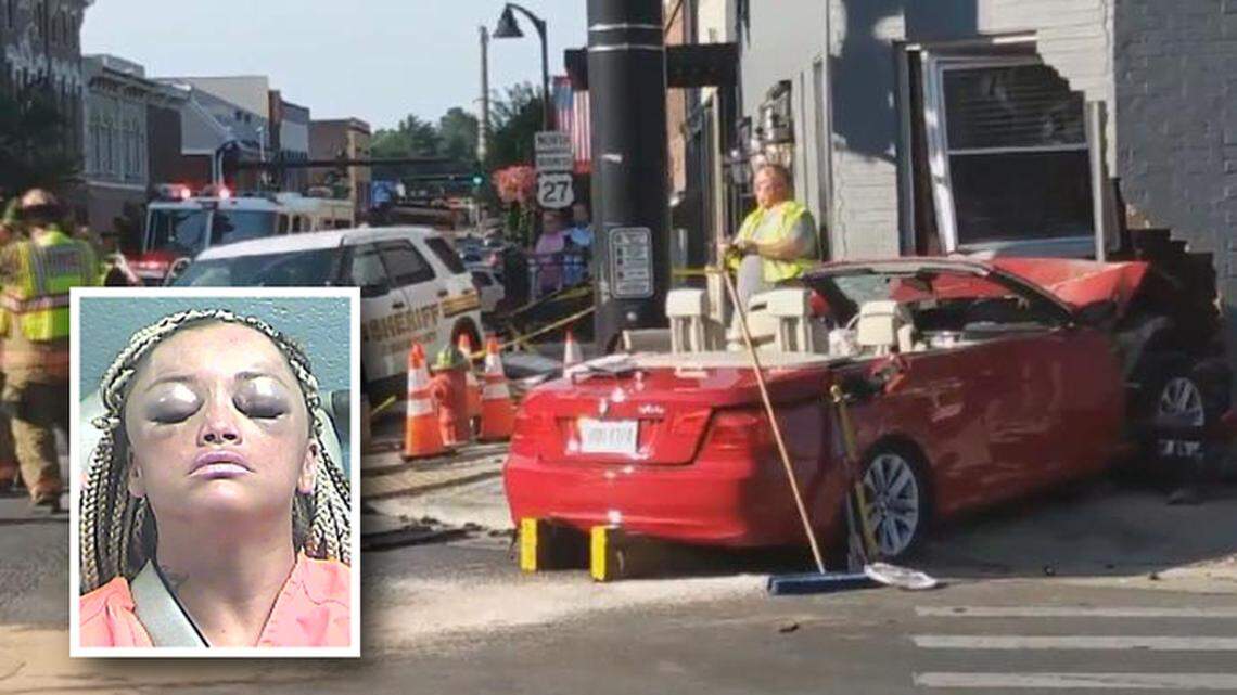 The red BMW convertible allegedly hit a a police cruiser and plowed into a downtown Nicholasville building. The driver Robin Terry, 42, has been charged.
