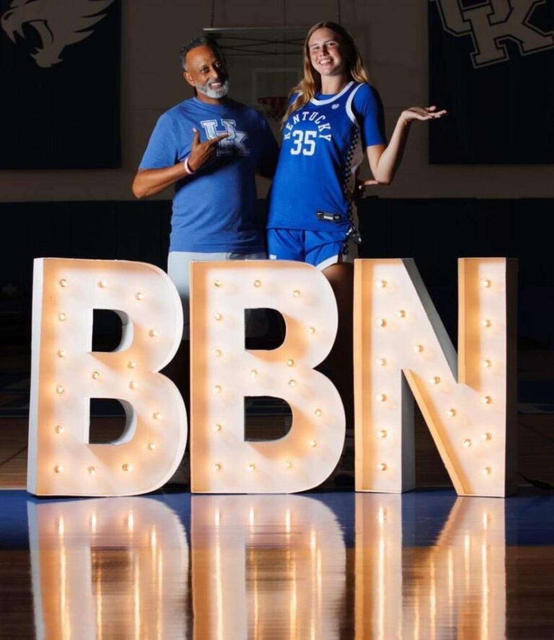 Kaelyn Carroll poses with Kentucky head coach Kenny Brooks during a recruiting visit to the Wildcats.