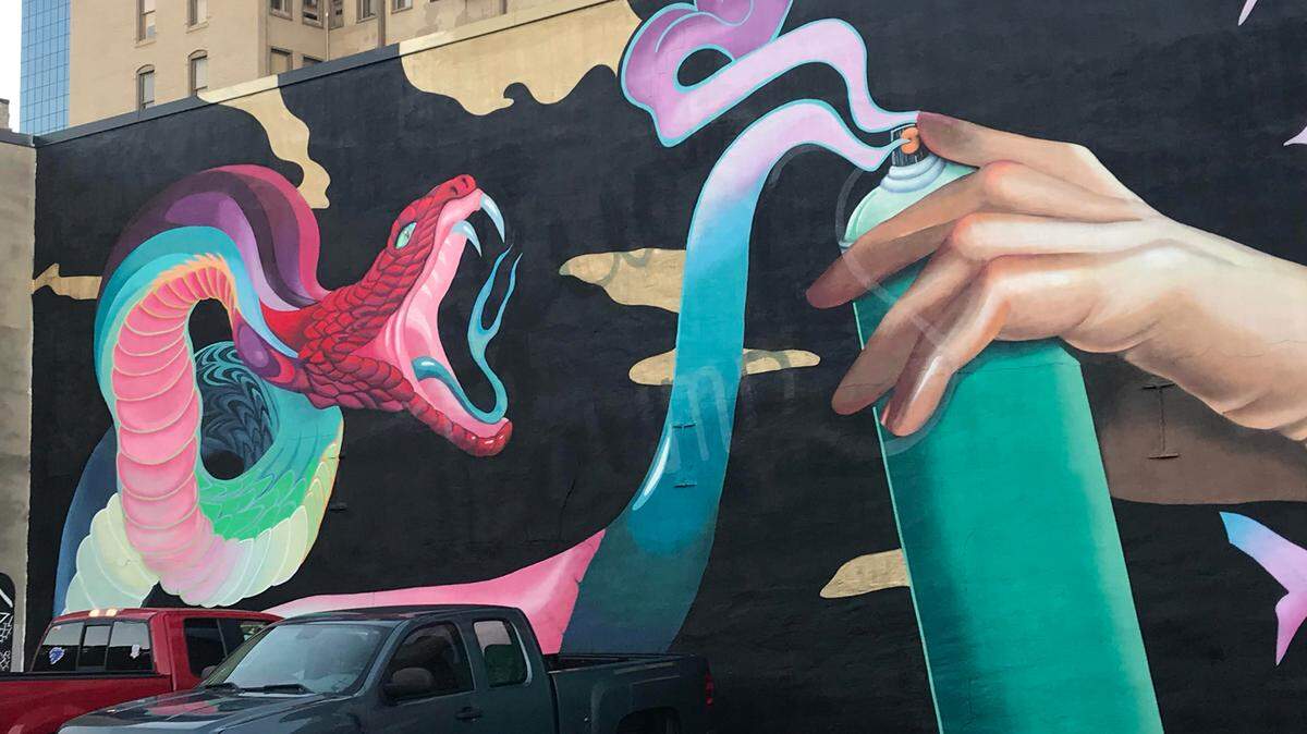 The mural by the artist ELLE has be altered to cover up an anti-Trump expletive.