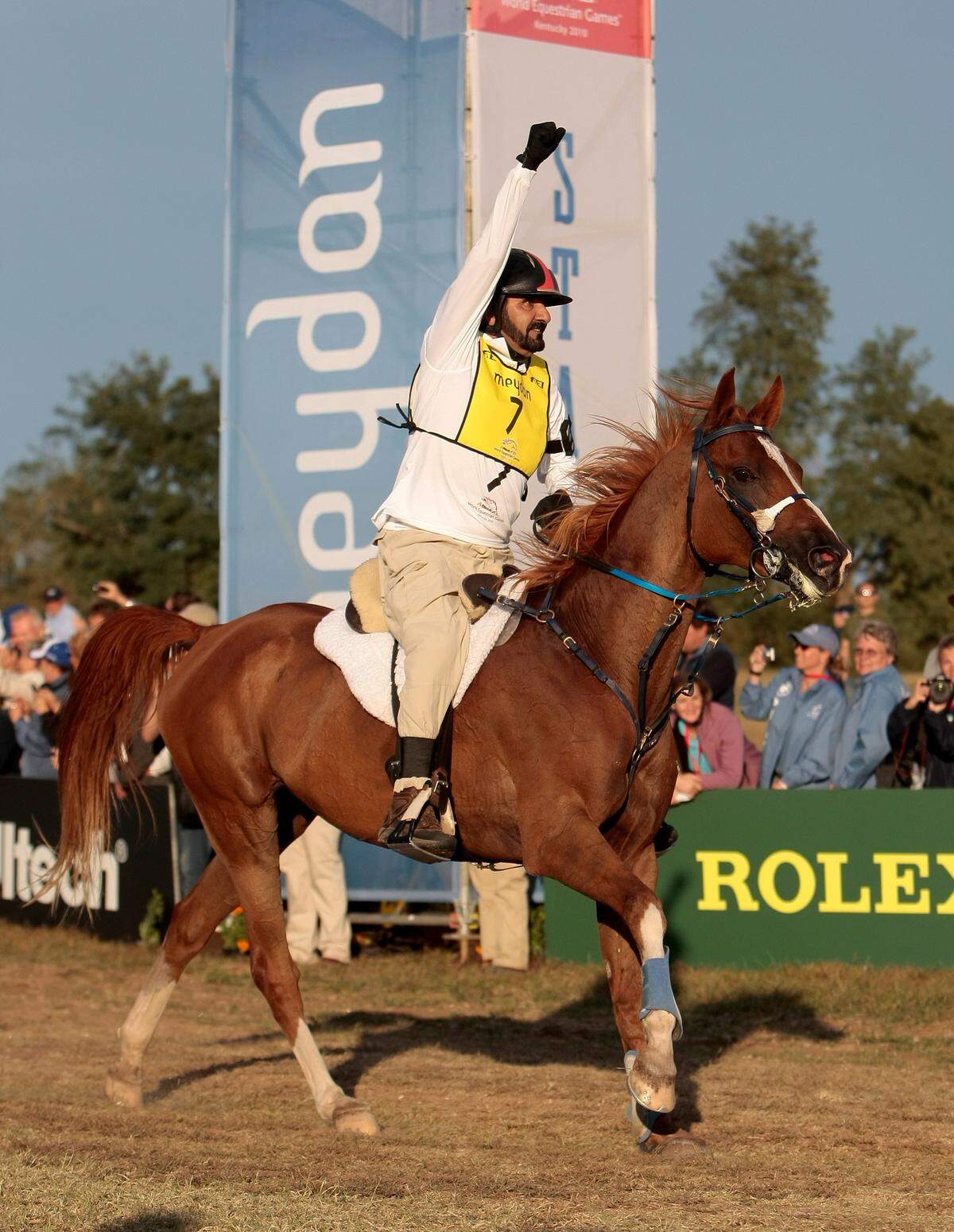 Shiekh Mohammed bin Rashid Al Maktoum of Dubai pumped his fist as he crossed the finish line in second place overall at the conclusion of the World Equestrian Games 100-mile endurance race at the Kentucky Horse Park in Lexington on Sept. 26, 2010.