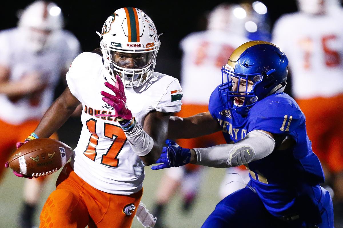 Micah Lowe (17) of Frederick Douglass ran past Henry Clay’s Cameron Maynard (11) during the Broncos’ 36-3 win over the Blue Devils at Henry Clay during the regular season. The Broncos enter the playoffs undefeated.