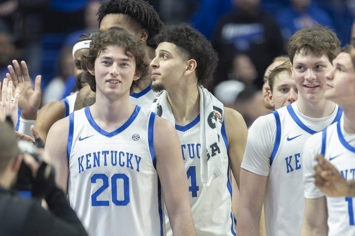 Kentucky forward Zach Tow (20) walks off the court with his teammates following Tuesday’s game against LSU at Rupp Arena.
