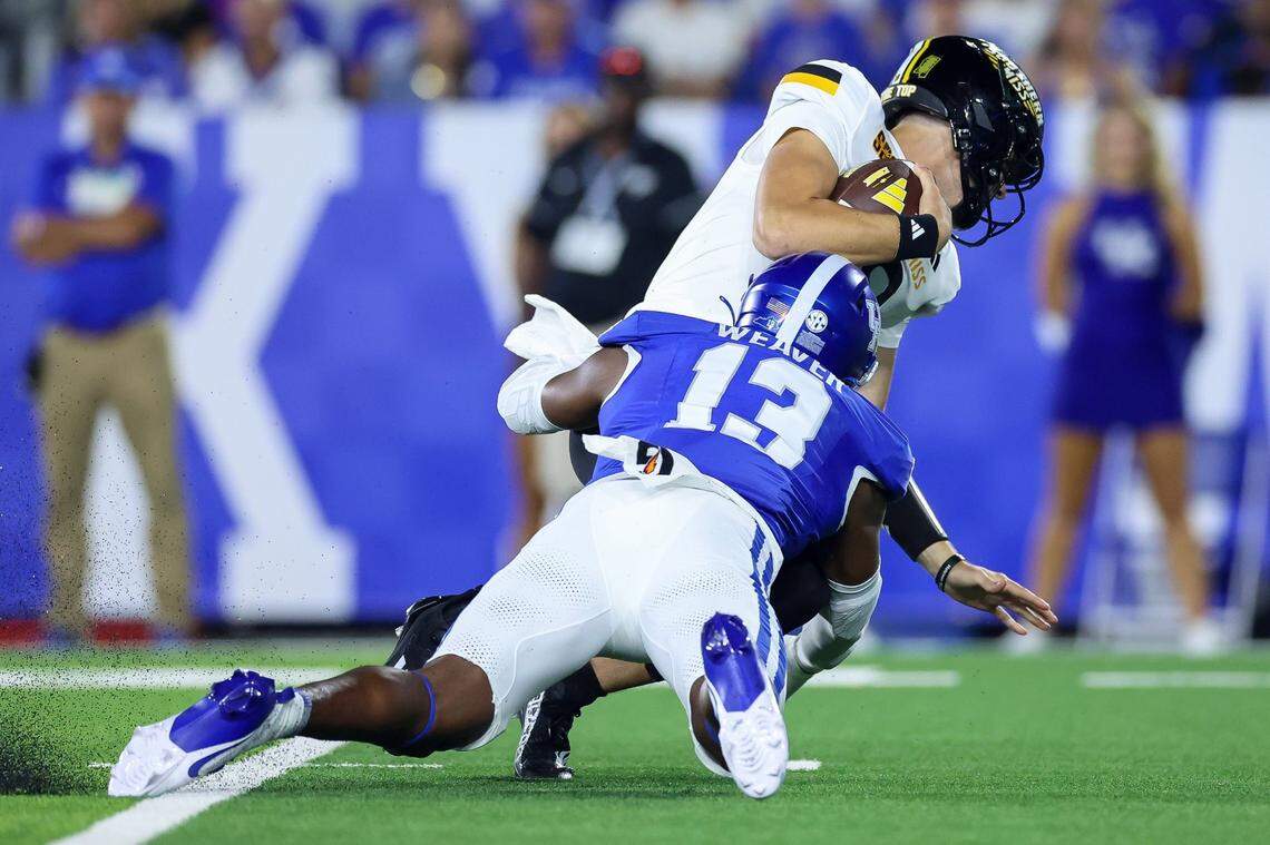 Kentucky’s J.J. Weaver sacks Southern Miss quarterback Tate Rodemaker during the season opener at Kroger Field on Saturday.