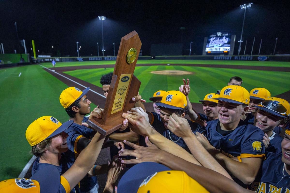 The Sayre Spartans celebrate their 11th Region baseball championship after an extra-innings win over Lexington Catholic at Kentucky Proud Park on the University of Kentucky campus on Wednesday.