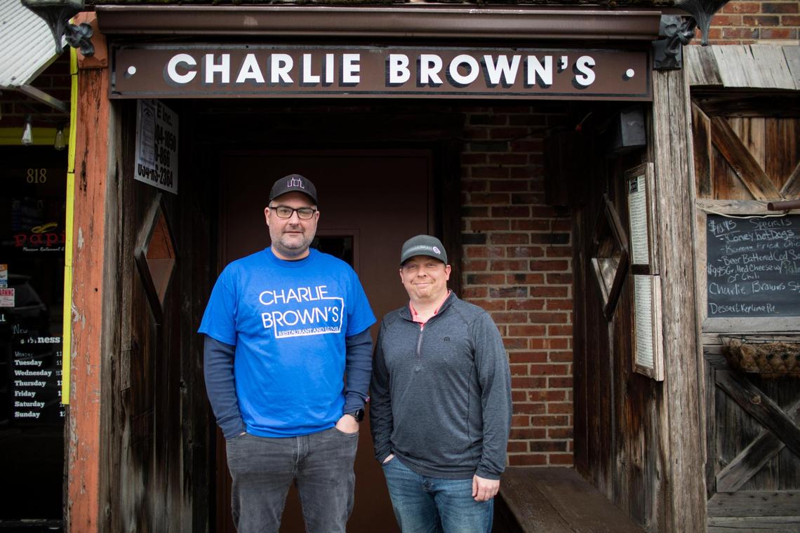 Co-owners Chris Brothers and Chris Behler (not pictured is third co-owner Sean Feld) outside Charlie Brown’s in Chevy Chase. They bought the restaurant and bar at the beginning of March.