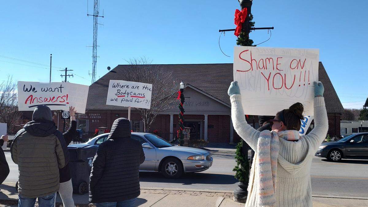 Protesters held signs outside the London Police Department in Laurel County, Ky., Saturday, Jan. 4, 2025, to call attention to the death of Douglas Harless. Harless died after being shot at his home by police who apparently had intended to go to a different address nearby to execute a search warrant.