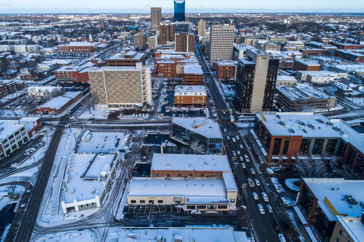 Snow covers building tops and parking lots in downtown Lexington, Ky., on Thursday, Jan. 20, 2022.