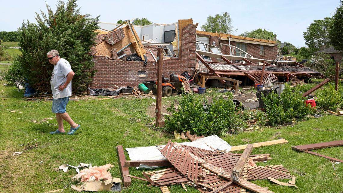 Lacy Castle surveyed the damage to his home and back patio on Cedar Ridge Drive in the Crooked Creek neighborhood east of London, Ky., Sunday, May 18, 2025. Two days earlier, thunderstorms and a deadly tornado ripped through the Laurel County, destroying many homes, including Castle’s, who survived the storm in his house along with his wife. Castle said storm took the roof in one piece, “boom and you could look at the sky.” Their roof landed scattered across the street he said.