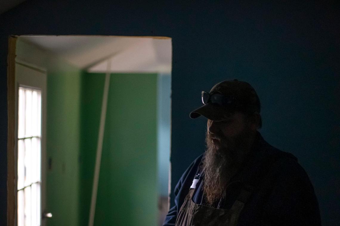 Wiley Hudson is photographed inside a house he is constructing for his mother along KY-15 near the Breathitt and Perry county line. Her home, along with with Hudson’s, was destroyed by flooding last summer. Hudson bought the shell of the structure already fabricated and has been working to finish the interior.