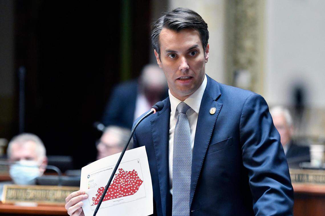 Kentucky Senator Morgan McGarvey holds a state map showing infection rate of COVID-19 among Kentucky counties during the opening day of the Kentucky General Assembly’s special session in Frankfort, Ky., Tuesday, Sept. 7, 2021. (AP Photo/Timothy D. Easley)
