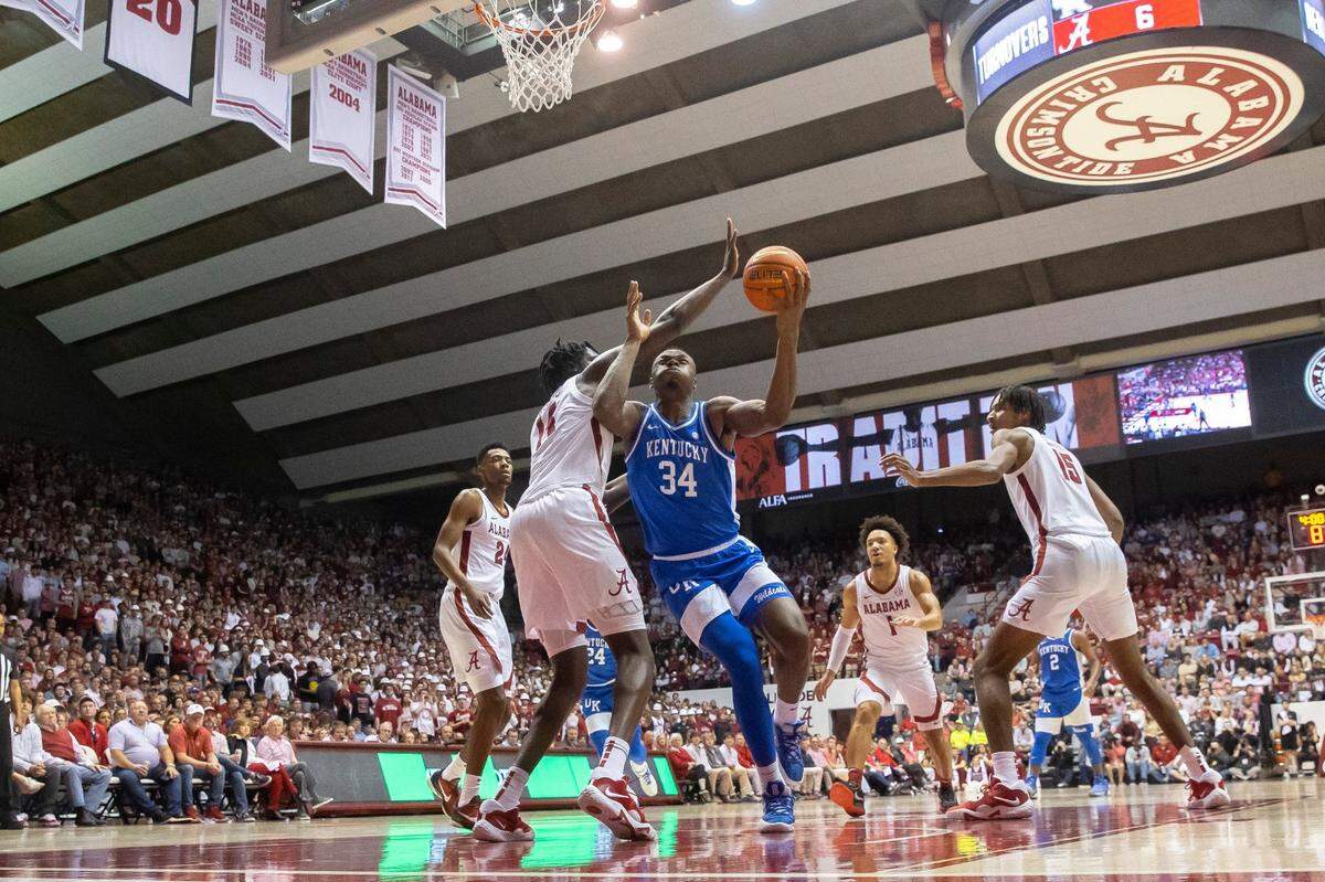 Kentucky forward Oscar Tshiebwe (34) gets to the basket as Alabama center Charles Bediako (14) defends during Saturday’s game at Coleman Coliseum in Tuscaloosa, Ala.