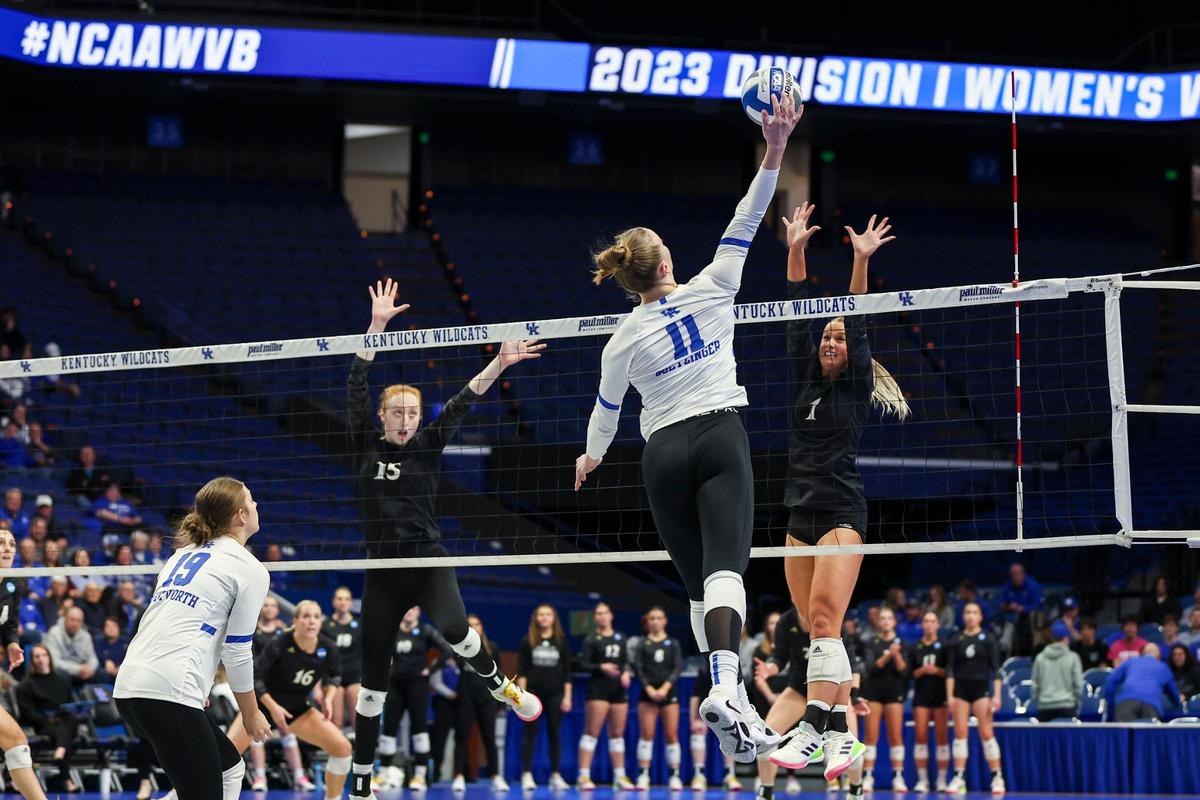 Kentucky volleyball senior middle blocker Elise Rutherford (11) spikes the ball against Wofford during an NCAA Tournament match at Rupp Arena last November. More than 2,169 fans watched the Wildcats defeat the Terriers.
