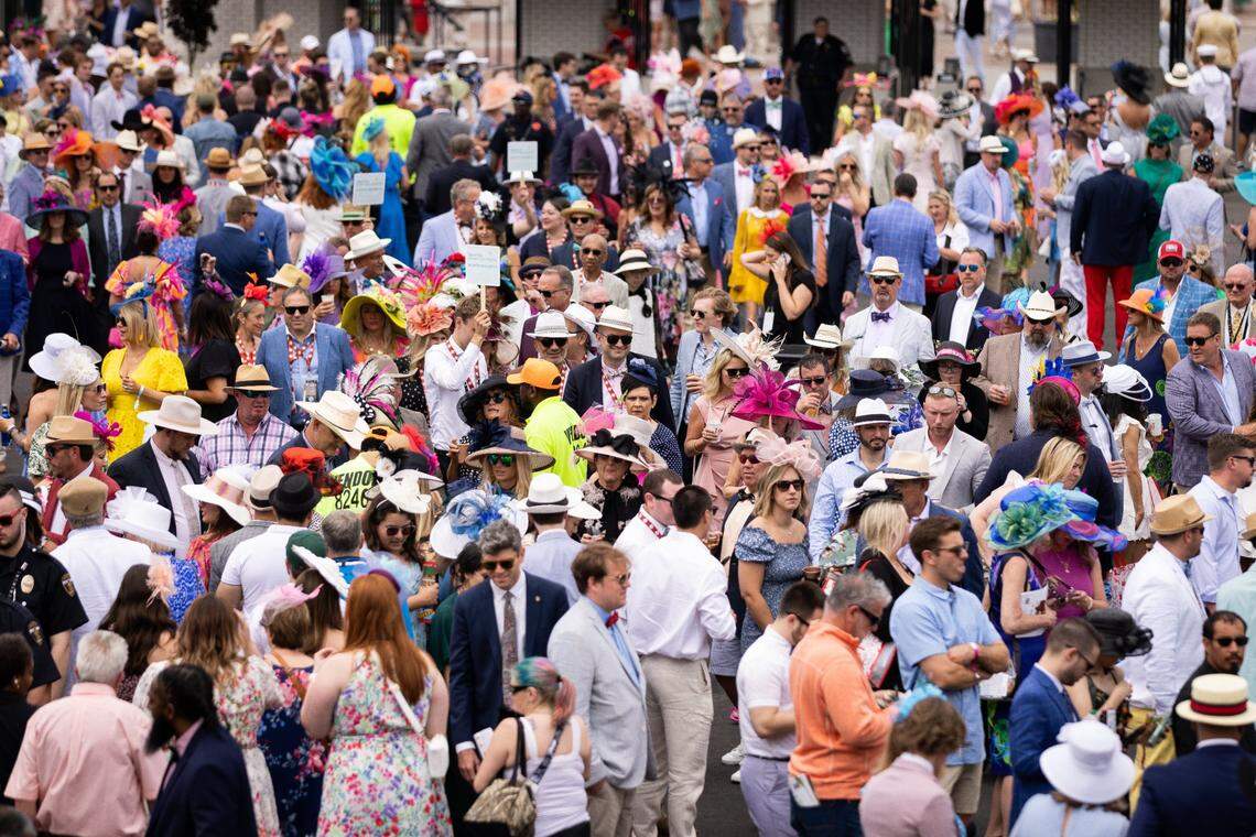 A crowd of guests moves past the paddock on Derby Day at Churchill Downs on Friday, May 6, 2023, in Louisville, Ky. (Jack Weaver/Herald-Leader)