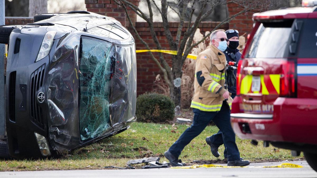 Lexington police and firefighters respond to the scene of a wreck at the intersection of Tates Creek Rd and Rockbridge Rd in Lexington, Ky., Thursday, January 14, 2021. Police also marked and collected shell casings along both roads.