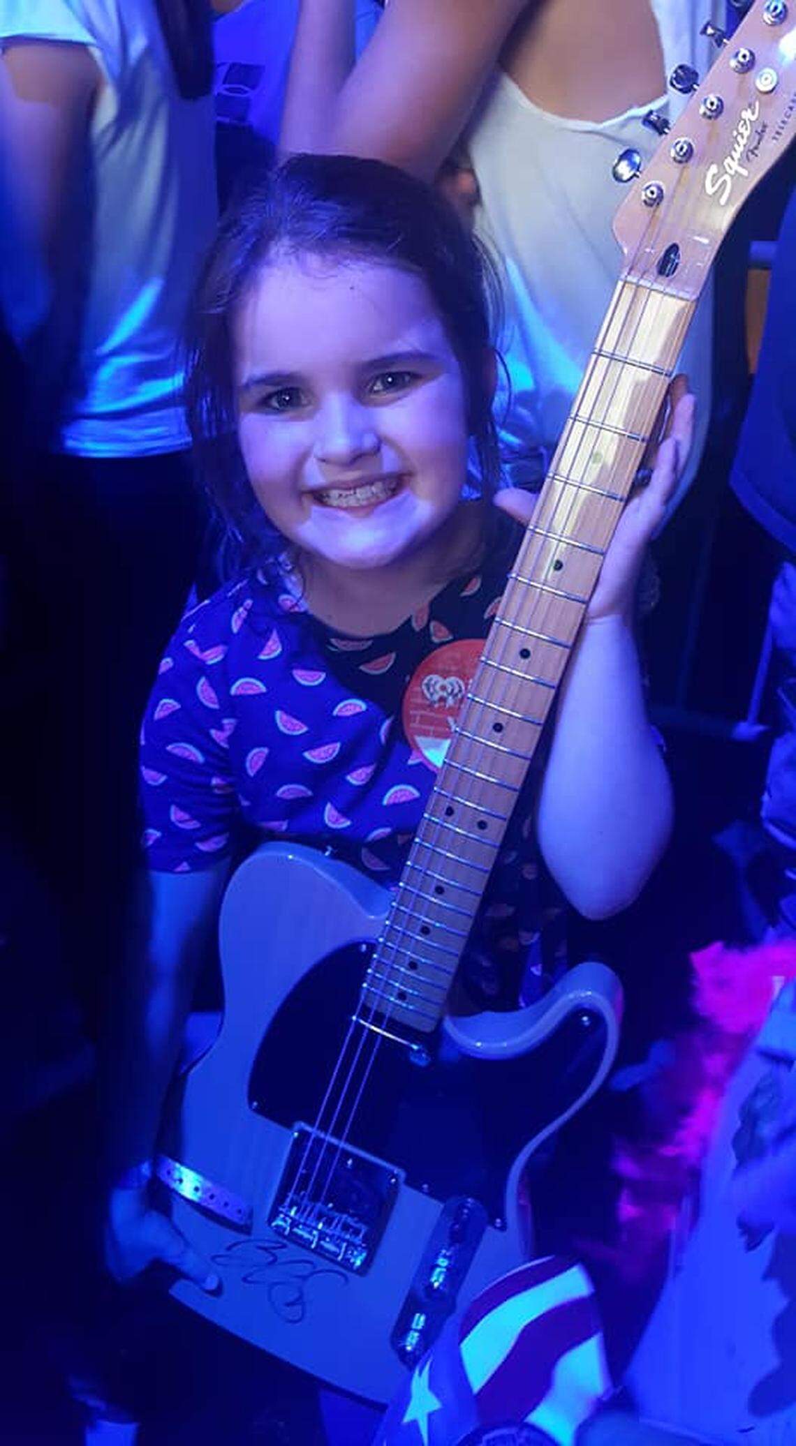 During country singer Brad Paisley’s performance at Red, White and Boom in Lexington Saturday night, he gave an unexpected surprise to one young fan. He gave 9-year-old Brooklynn Goodin, pictured, his signed guitar that he played during the set.