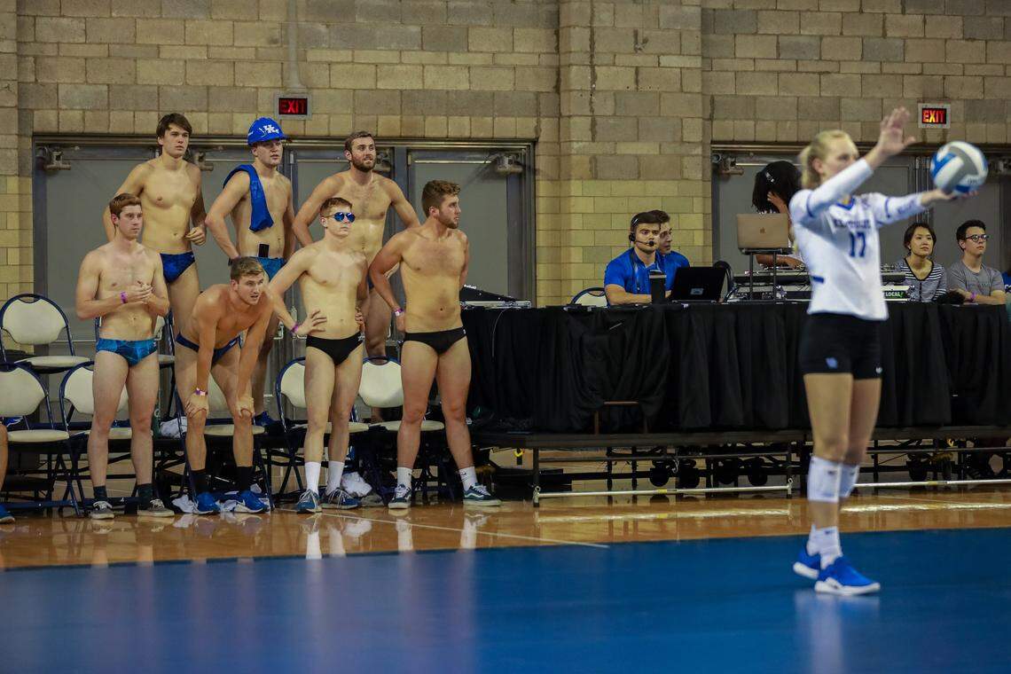 The UK swim team watches the volleyball game in the swimsuits during the UK vs University of Louisville volleyball game at Memorial Coliseum in Lexington, Ky., on Friday, Sept. 20, 2019. Kentucky swept Louisville 3-0.