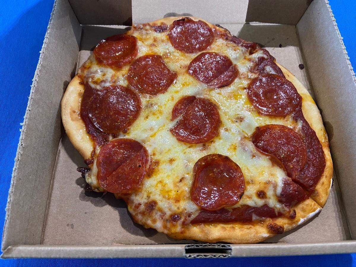 A personal pepperoni pizza from a LaRosa’s Pizzeria stand at Kroger Field.