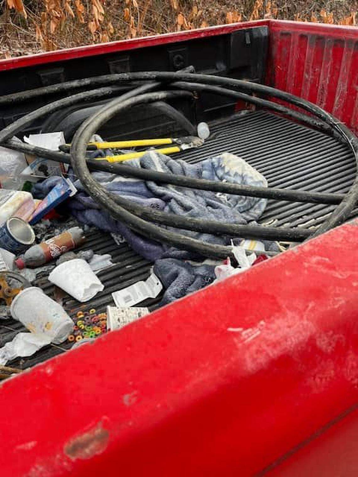 A photo taken by police in Clay County shows wire in a pickup trick that police said people cut down in order to take the copper inside it.