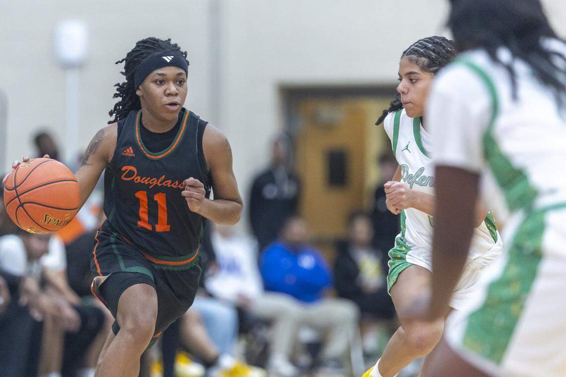 Frederick Douglass point guard Mikalee Bennett drives forward during the Broncos’ 45-24 win at Bryan Station High School on Thursday. On Friday, Bennett scored 24 points in a stunning 83-63 upset over No. 1 Sacred Heart.