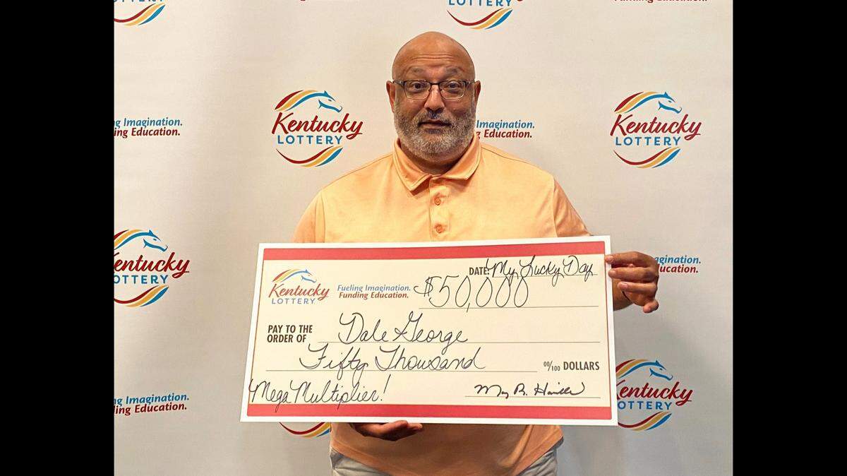 Dale George, of Nicholasville, poses with his big check last week after winning $50,000 on a Kentucky Lottery Mega Multiplier! scratch-off ticket.