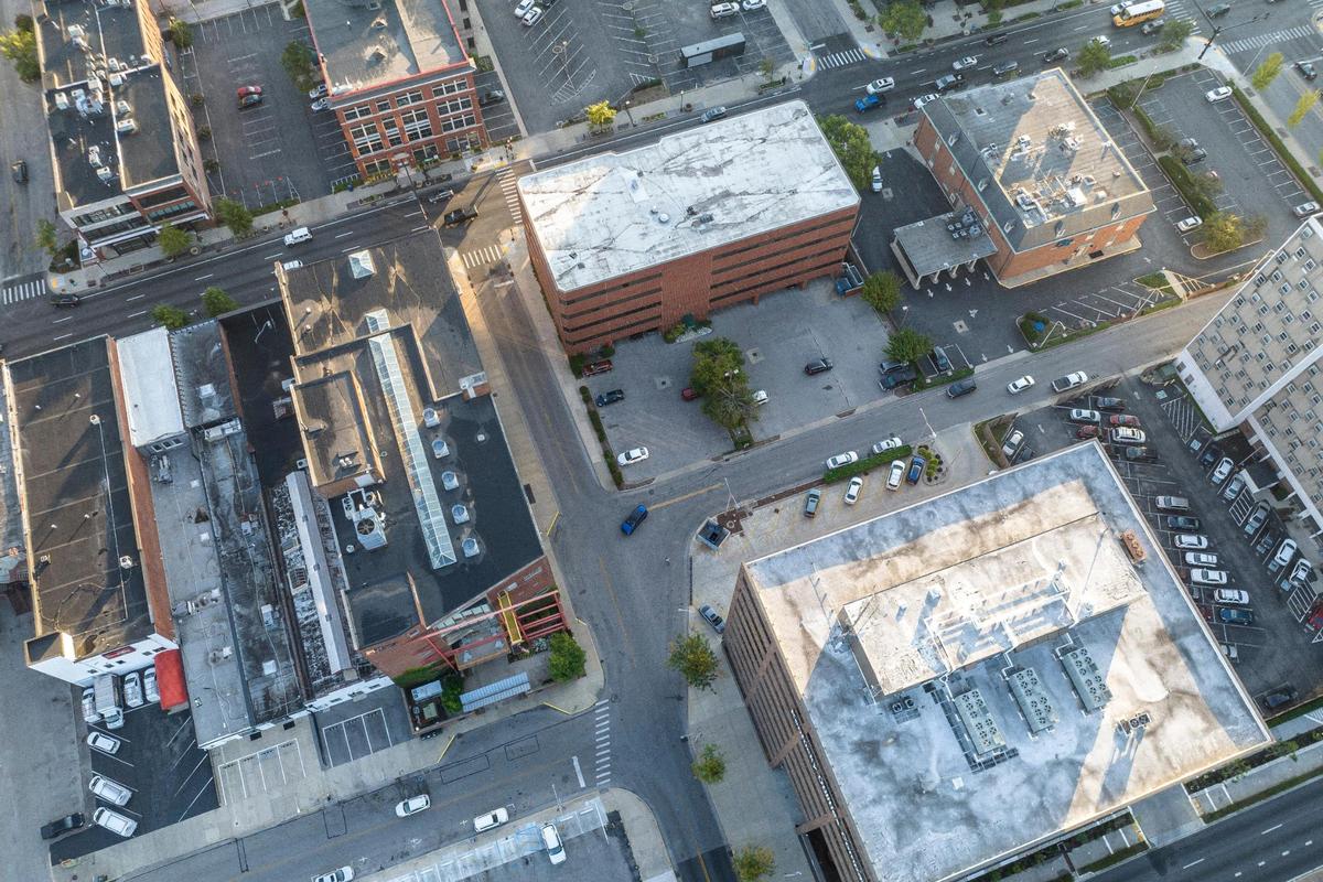 Today the Ades-Lexington Dry Goods Co. building is offices, but most people might remember it as the former location of Portofino restaurant on the first floor. Gray Construction offices are to the left of the KU headquarters.