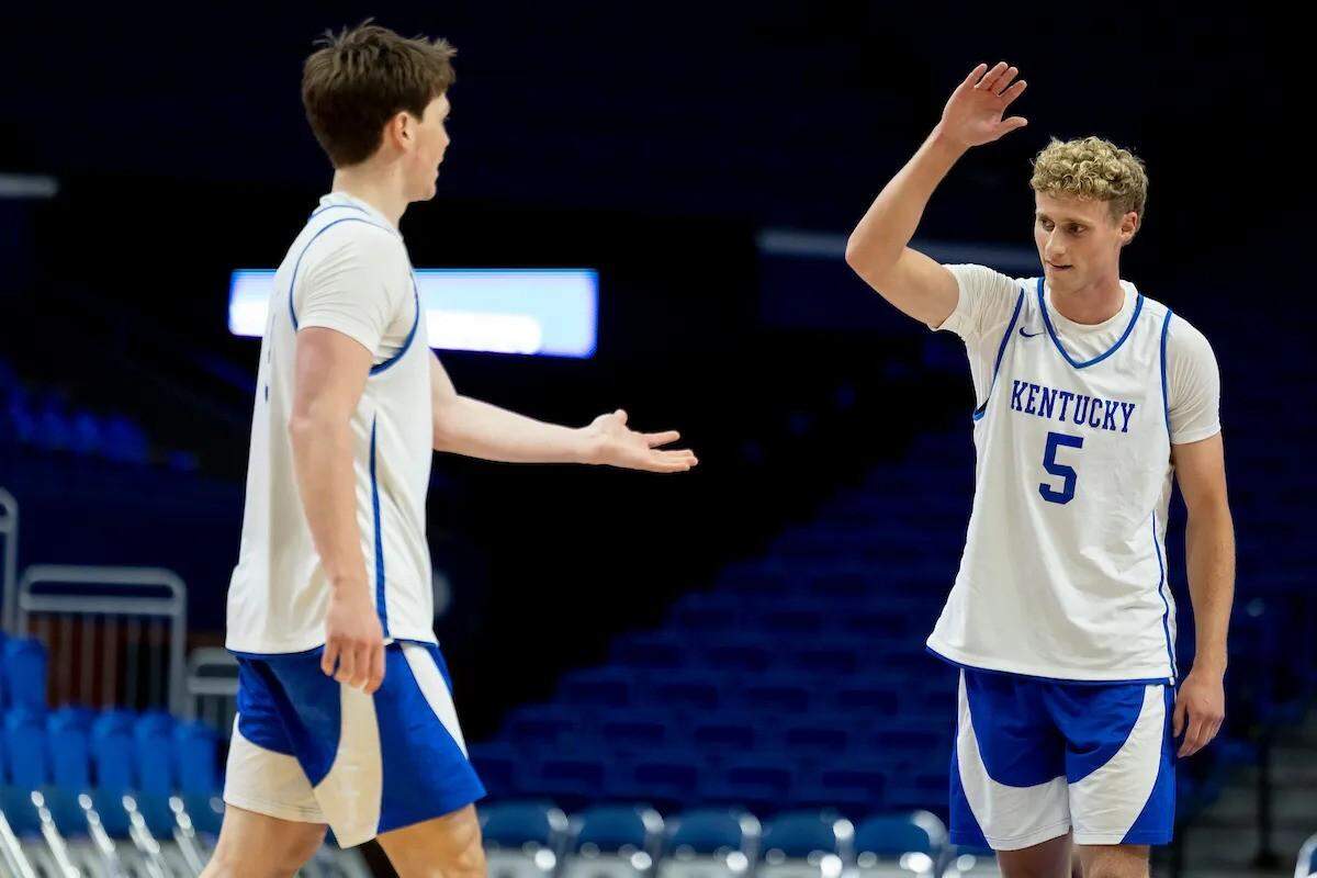 Collin Chandler, right, gets a high-five from fellow UK freshman Trent Noah during a practice in Rupp Arena.