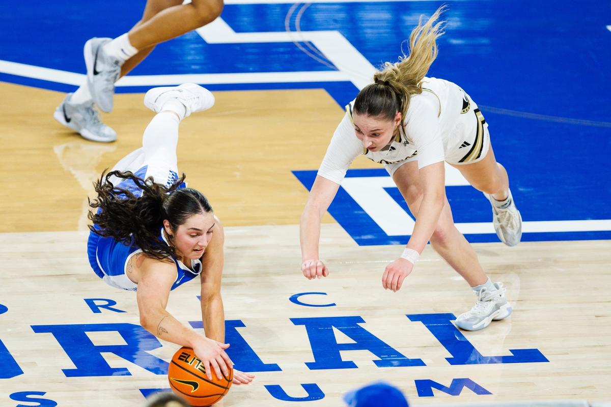 Kentucky’s Georgia Amoore dives for a loose ball during the first half of the Wildcats’ victory over Wofford in Memorial Coliseum on Tuesday night. UK improved to 3-0 heading into its rivalry showdown Saturday against Louisville.